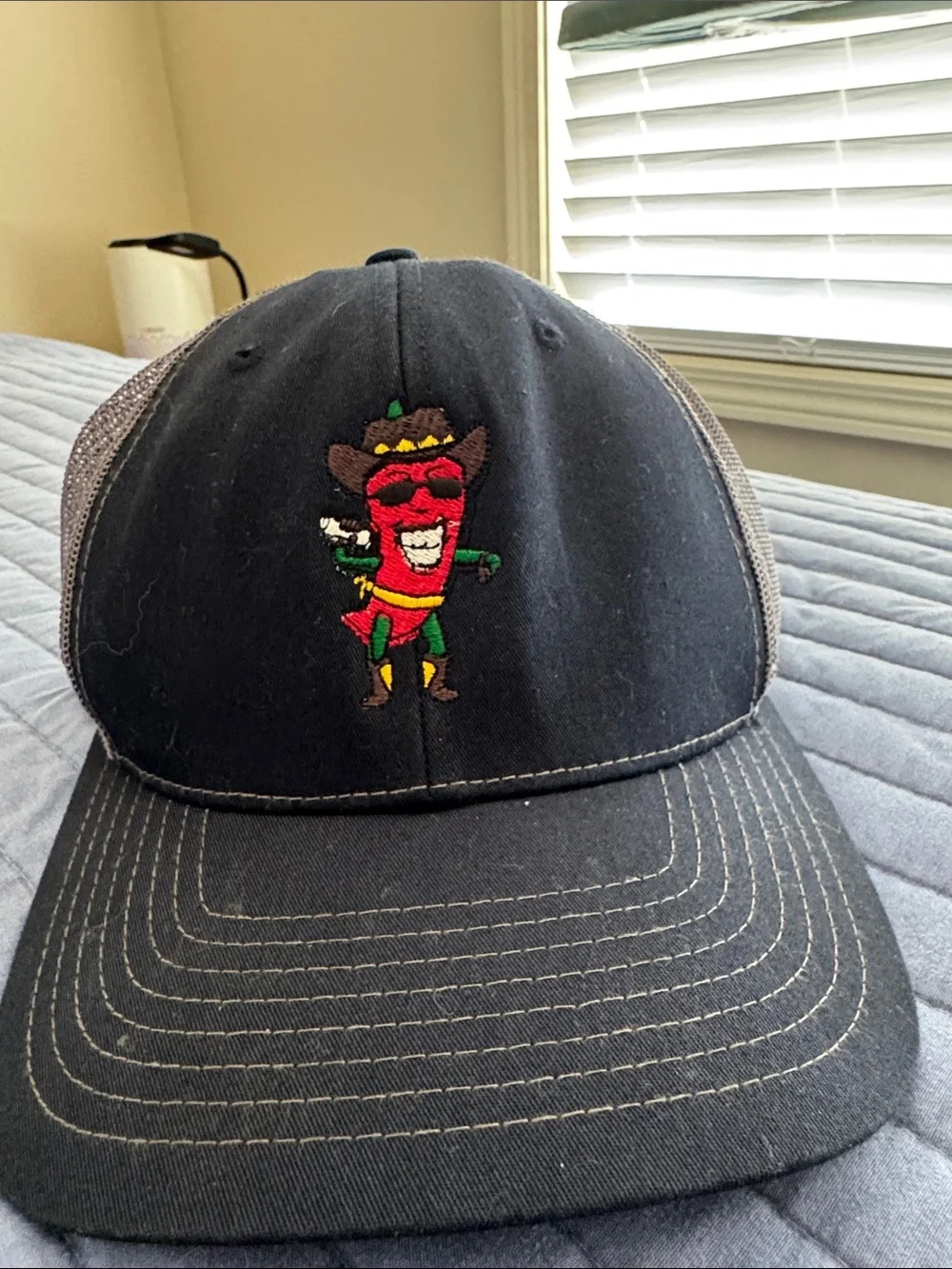 Men’s Black Trucker Hat with cowboy chili